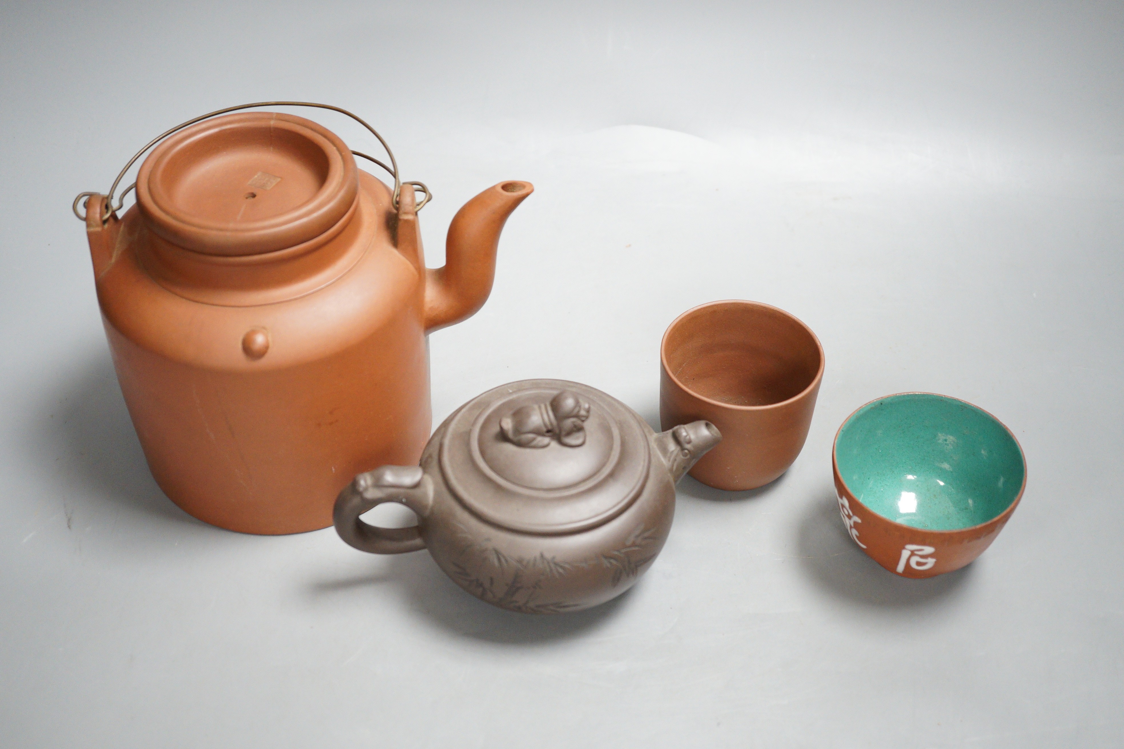 Two Chinese Yixing teapots and two similar teabowls. Tallest 14cm